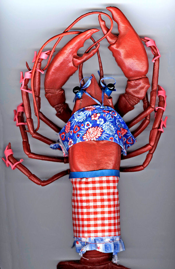 A lobster wearing a Barbie doll outfit